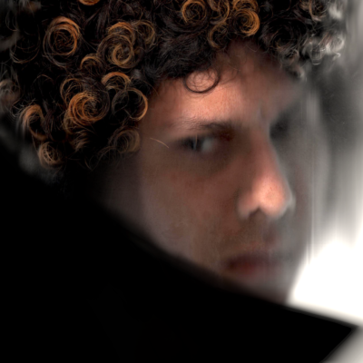 onirologia looks pensive and slightly out of focus with luscious curly hair